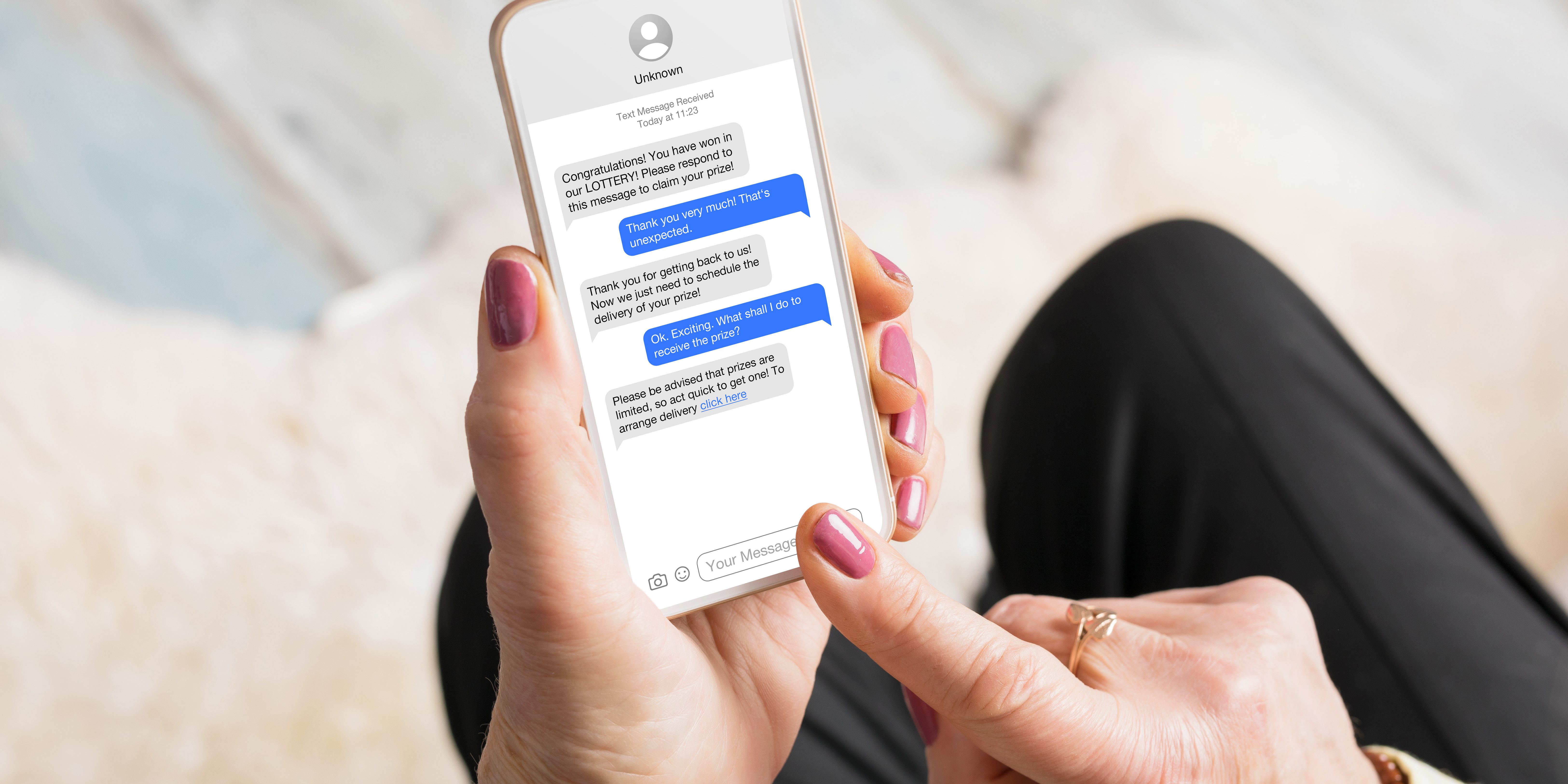 Old woman receiving scam messages on her mobile phone